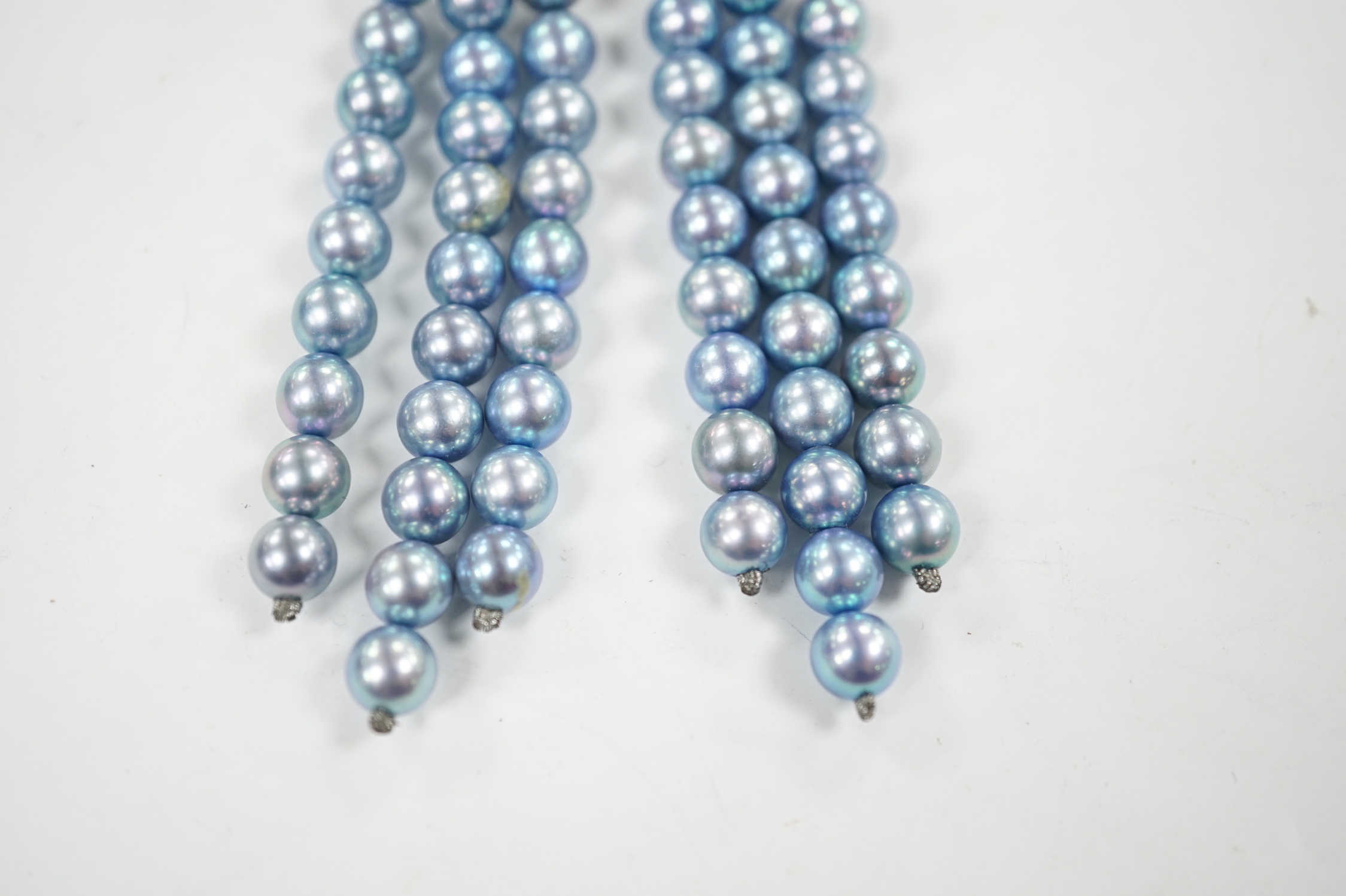 A modern pair of white metal, diamond chip cluster and bluey/grey three row cultured pearl tassel drop earrings, 89mm.